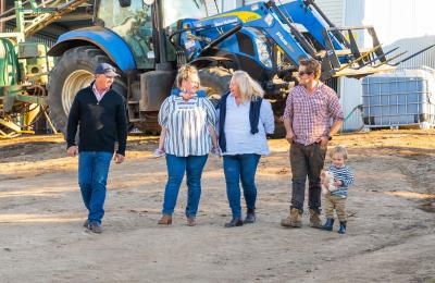 People walking near a tractor