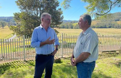 Two men at farm property.