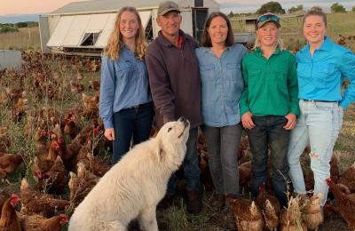 RIC loan customers and eggs farmers standing together